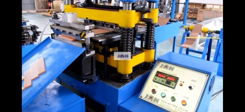 Fin forming machine